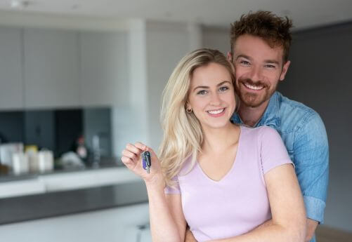 Man and Woman happy to be new homeowners